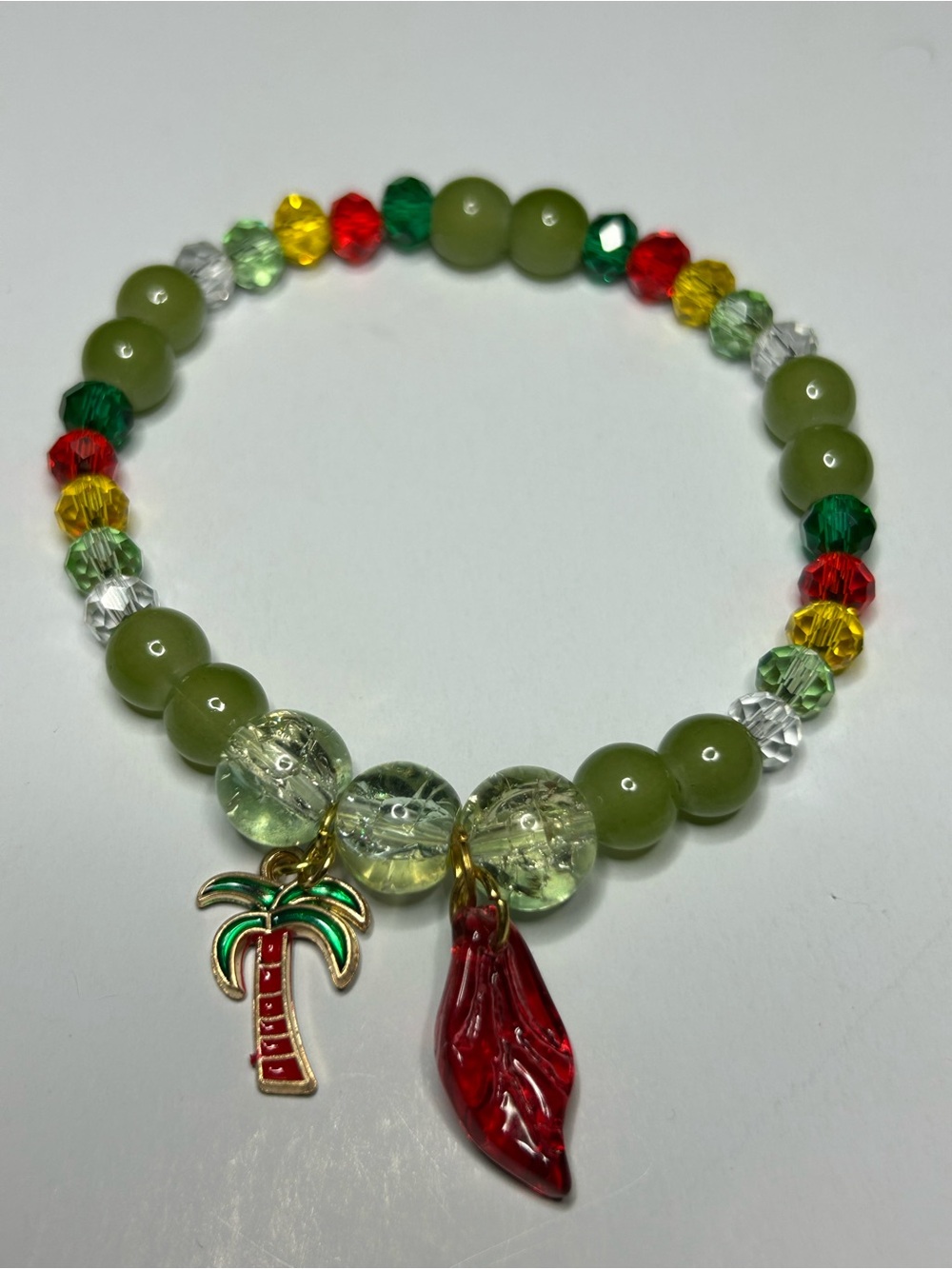 Green Beaded Stretch Bracelet with Red Charm & Palm Tree